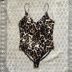 Cheetah print body suit.